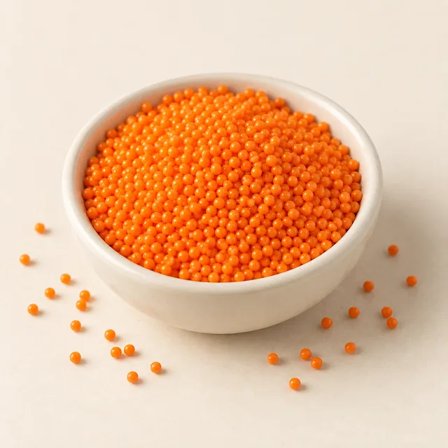 Eigene Illustration: Kleine orange Zuckerperlen in einer neutralen Schale